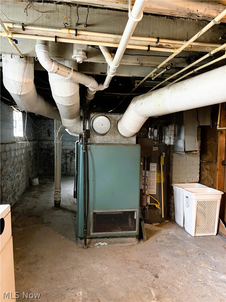 969 Evangeline Road Cleveland, OH 44110 - Photo 31 of 38 Basement featuring heating unit and water heater