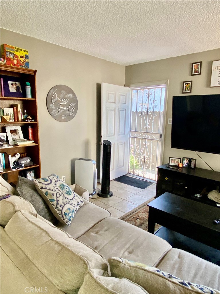 5846 Gardenia Avenue Long Beach, CA 90805 - Photo 17 of 28 a bedroom with a bed and a flat screen tv