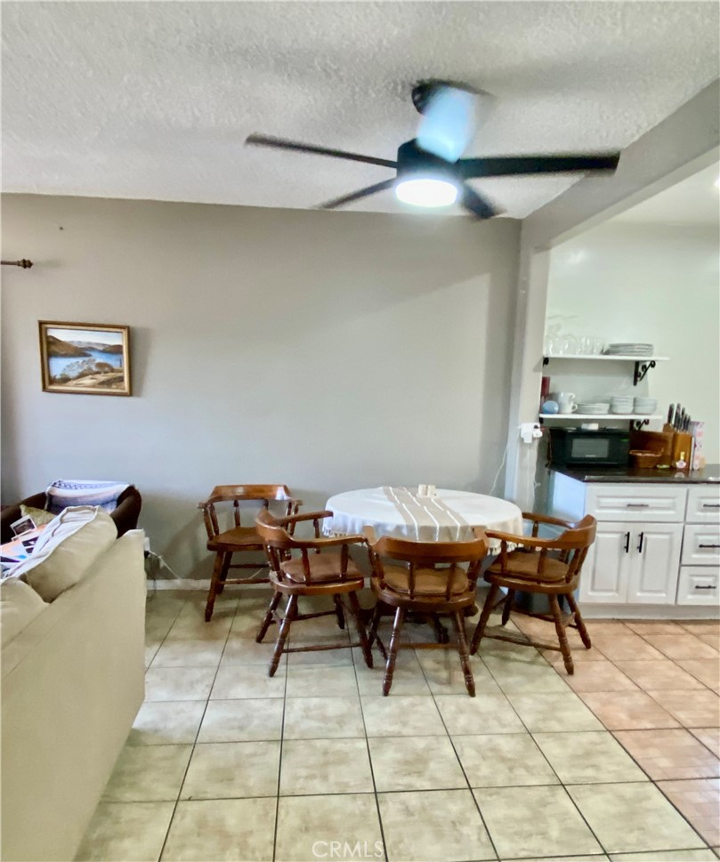 5846 Gardenia Avenue Long Beach, CA 90805 - Photo 18 of 28 a view of a dining room with furniture and chandelier
