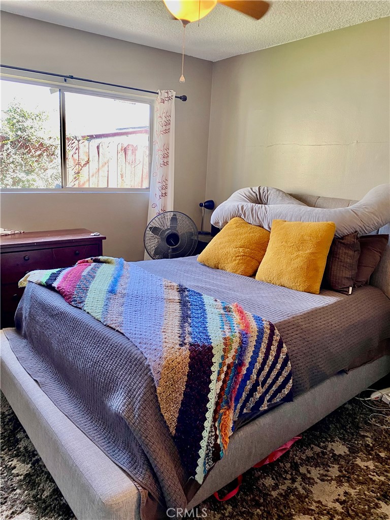 5846 Gardenia Avenue Long Beach, CA 90805 - Photo 20 of 28 a bedroom with a bed and a couch