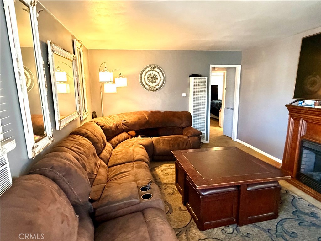 5846 Gardenia Avenue Long Beach, CA 90805 - Photo 22 of 28 a living room with a couch and a flat screen tv