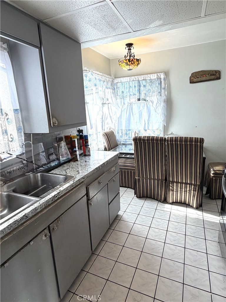 5846 Gardenia Avenue Long Beach, CA 90805 - Photo 24 of 28 a kitchen with a sink a counter and window
