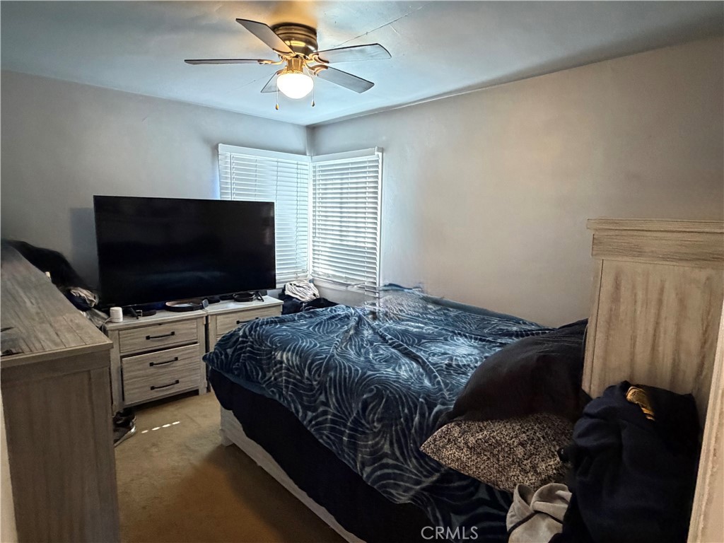 5846 Gardenia Avenue Long Beach, CA 90805 - Photo 26 of 28 a bedroom with a bed and a flat screen tv