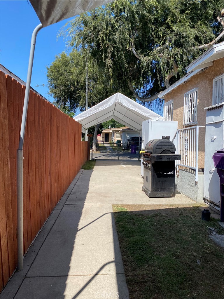 5846 Gardenia Avenue Long Beach, CA 90805 - Photo 5 of 28 a front view of a house with a garden