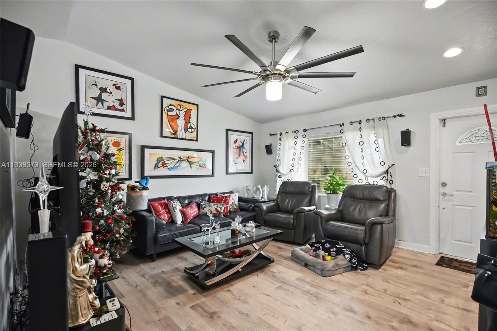 13574 Southwest 49th Lane Miami, FL 33175 - Photo 12 of 36 a living room with furniture ceiling fan and a window