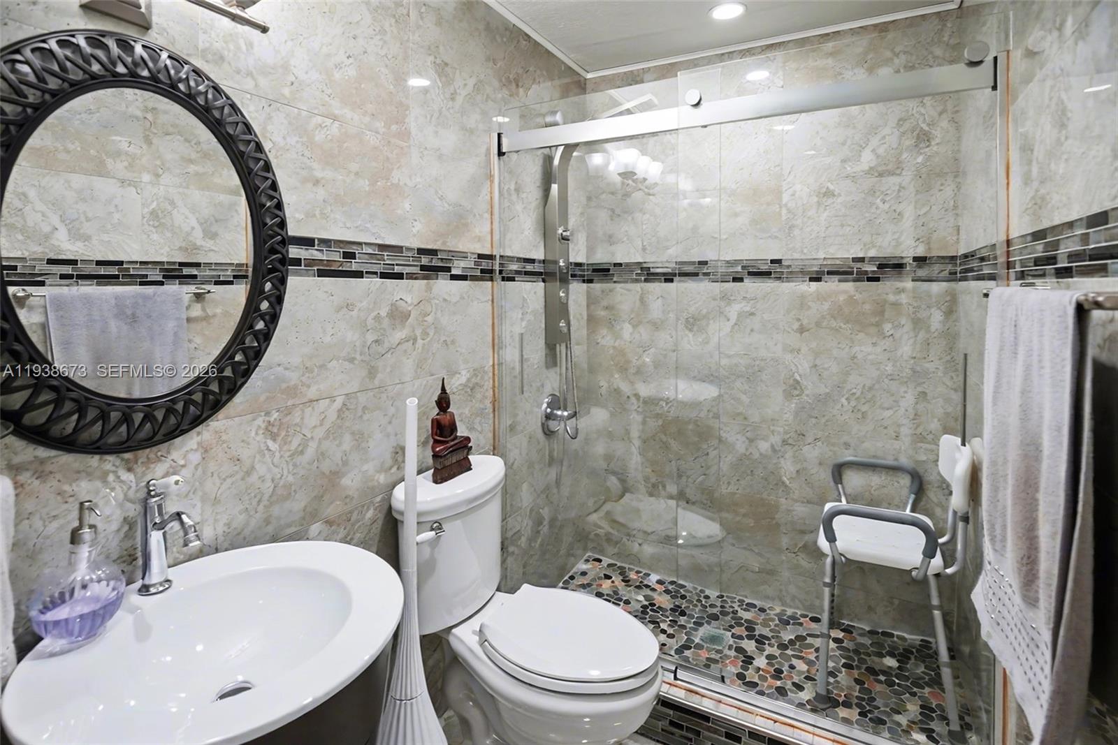 13574 Southwest 49th Lane Miami, FL 33175 - Photo 13 of 36 a bathroom with a sink a toilet and a mirror