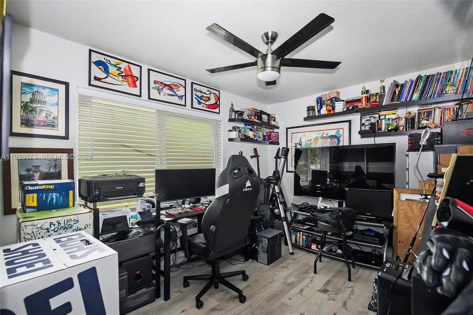 13574 Southwest 49th Lane Miami, FL 33175 - Photo 15 of 36 a room with furniture and a flat screen tv