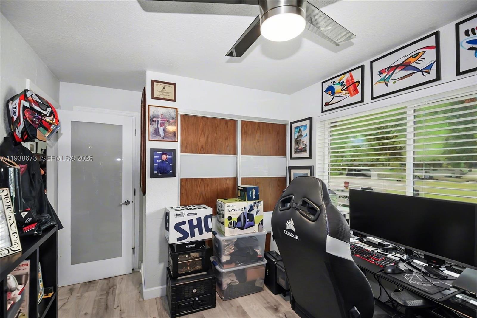 13574 Southwest 49th Lane Miami, FL 33175 - Photo 17 of 36 a view of a workspace with furniture and a window