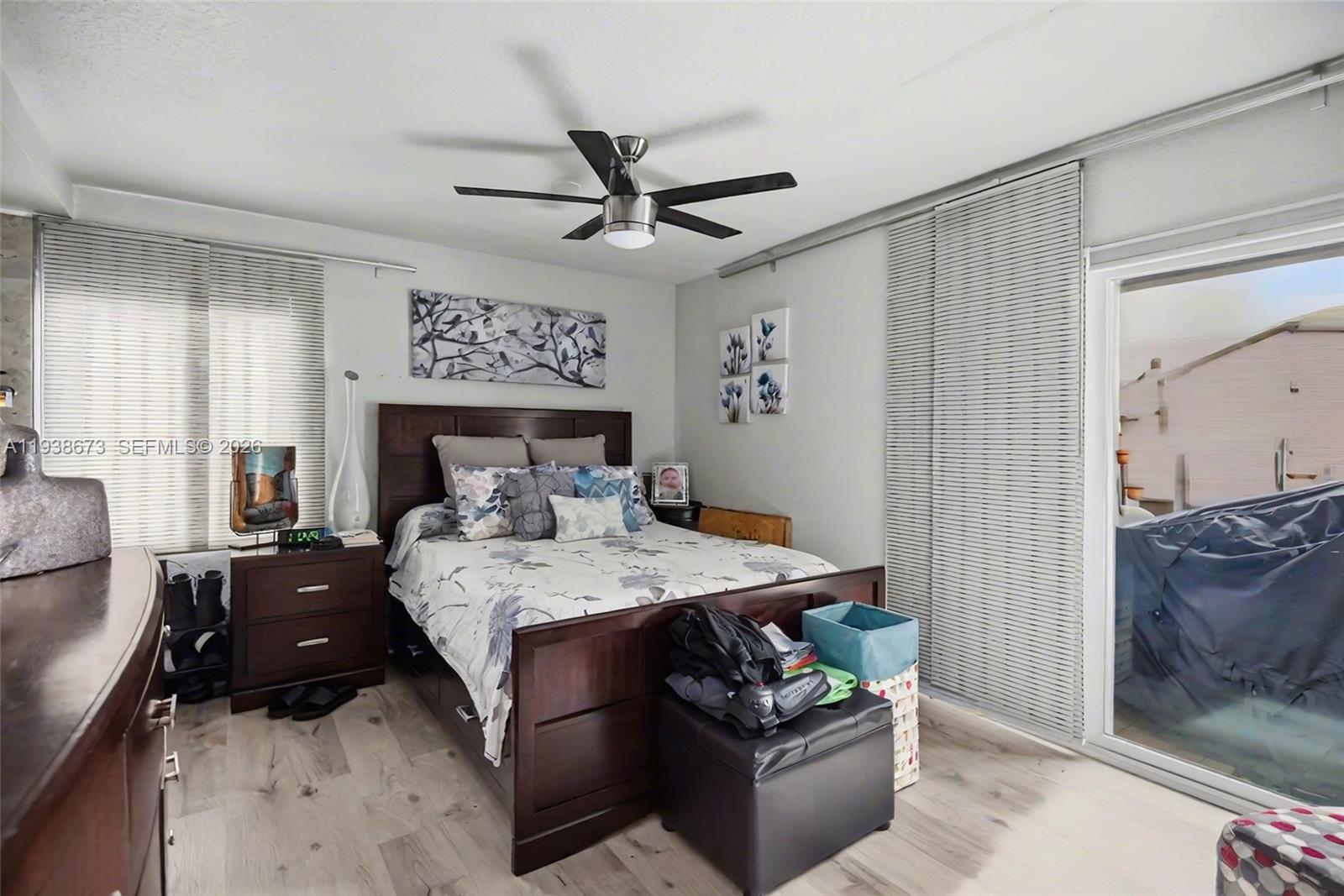 13574 Southwest 49th Lane Miami, FL 33175 - Photo 18 of 36 a bedroom with a bed and a dresser