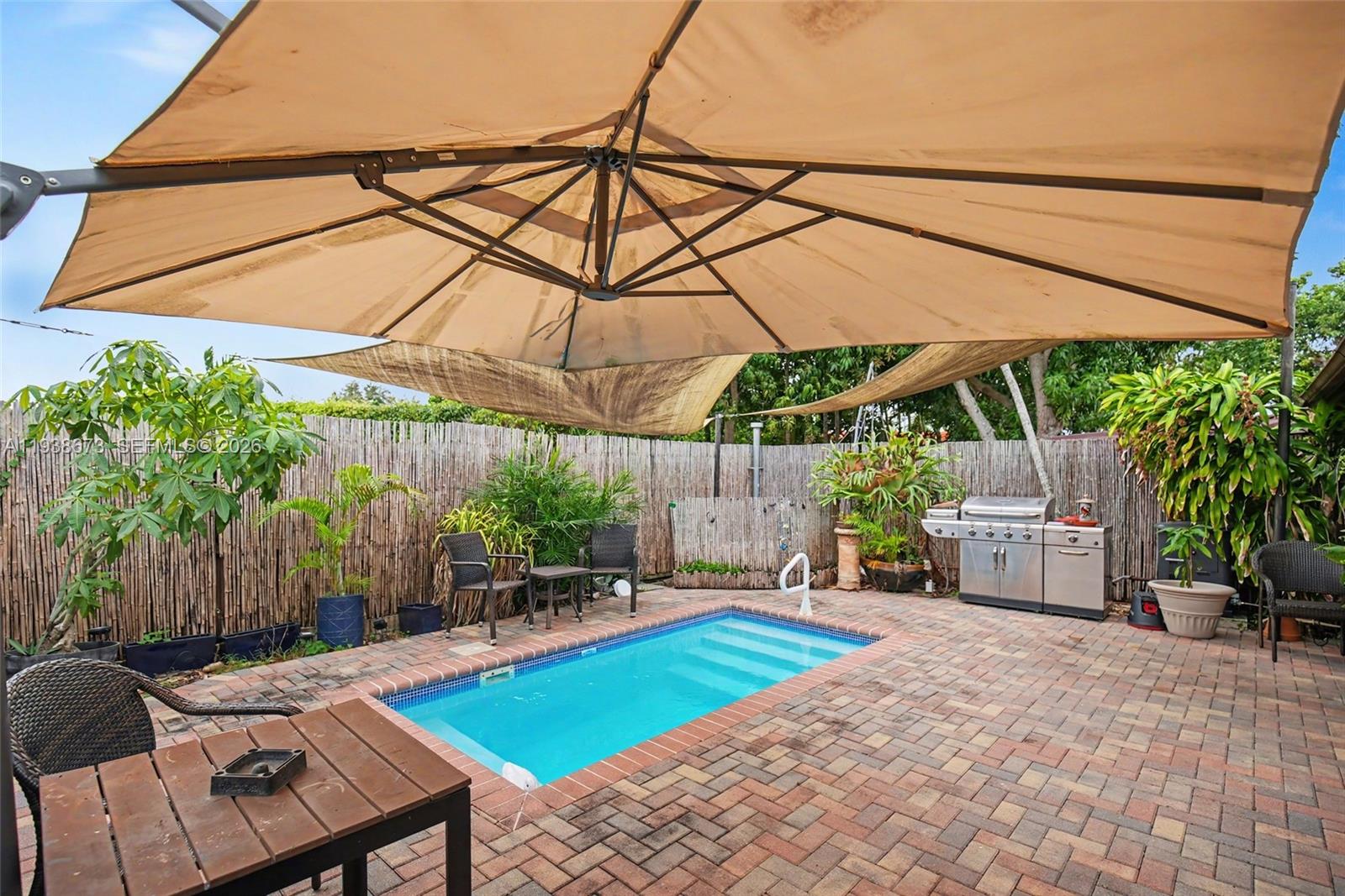 13574 Southwest 49th Lane Miami, FL 33175 - Photo 28 of 36 a backyard of a house with seating space