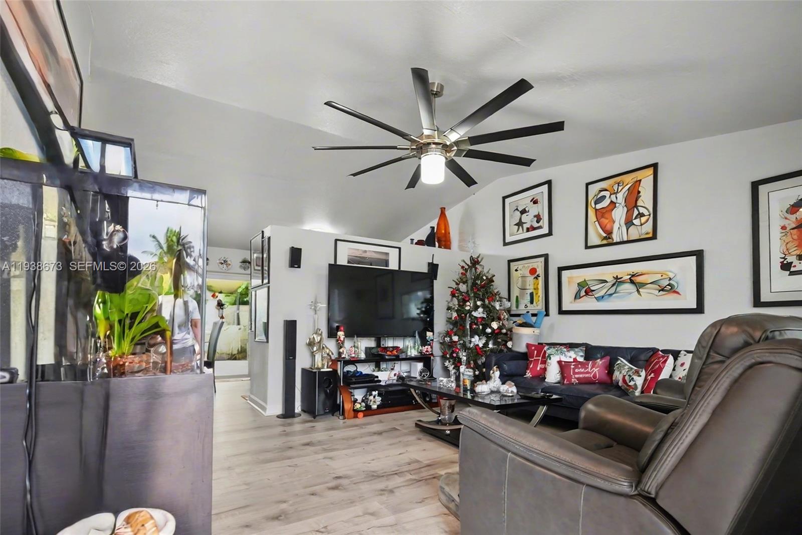 13574 Southwest 49th Lane Miami, FL 33175 - Photo 3 of 36 a view of a livingroom with furniture and a flat screen tv