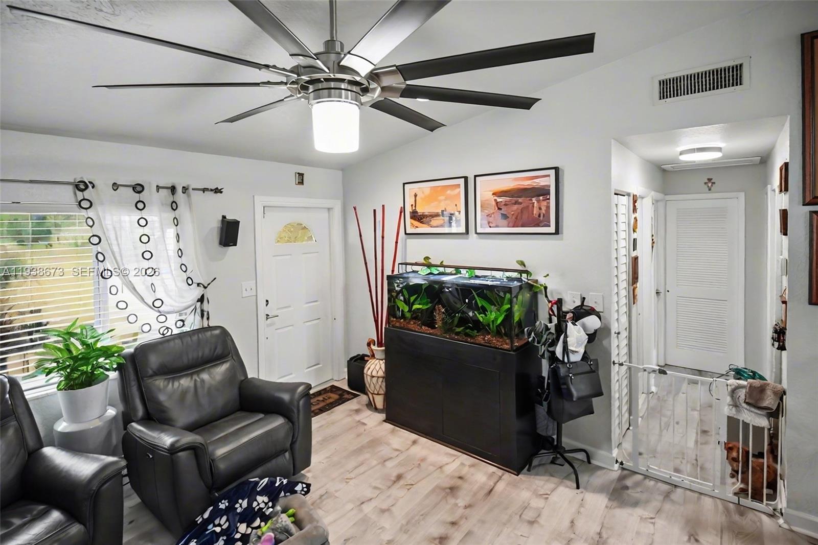 13574 Southwest 49th Lane Miami, FL 33175 - Photo 5 of 36 a living room with furniture and a potted plant