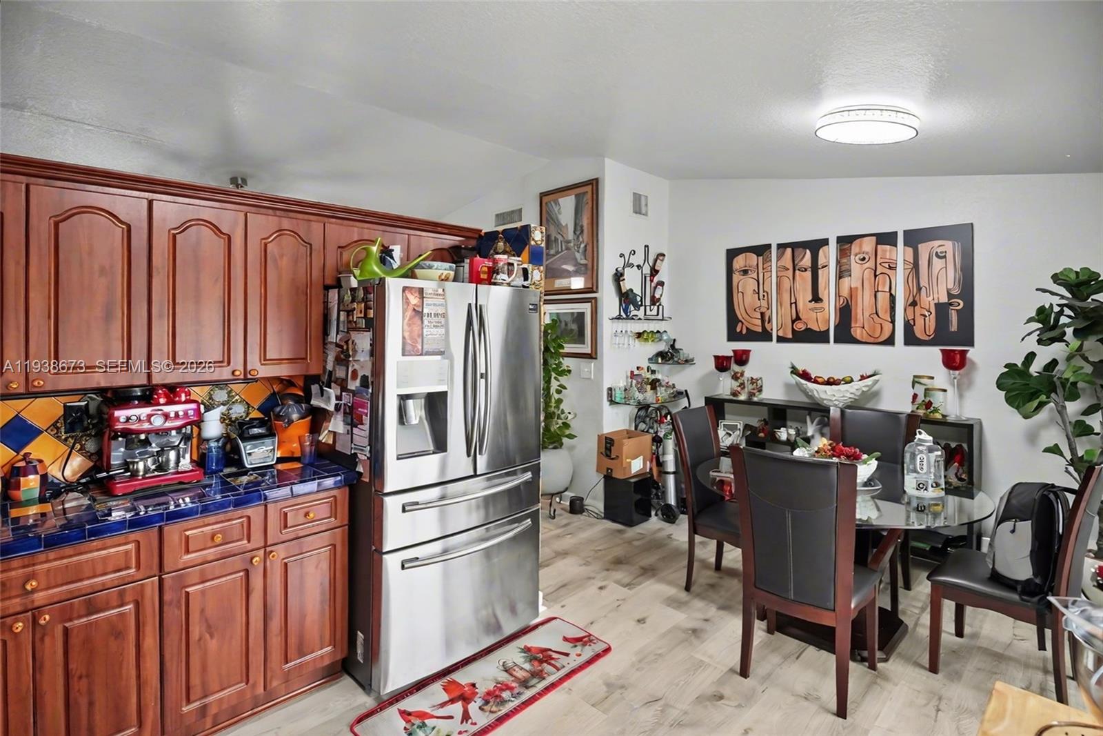 13574 Southwest 49th Lane Miami, FL 33175 - Photo 6 of 36 a kitchen with stainless steel appliances granite countertop a refrigerator and a stove