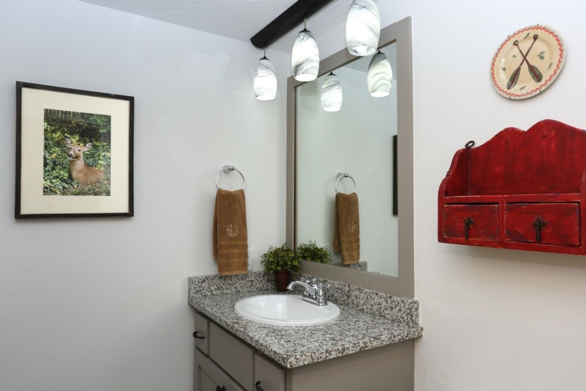 21680 Highway 6, Unit 2058 Keystone, CO 80435 - Photo 11 of 33 a bathroom with a granite countertop sink and a mirror