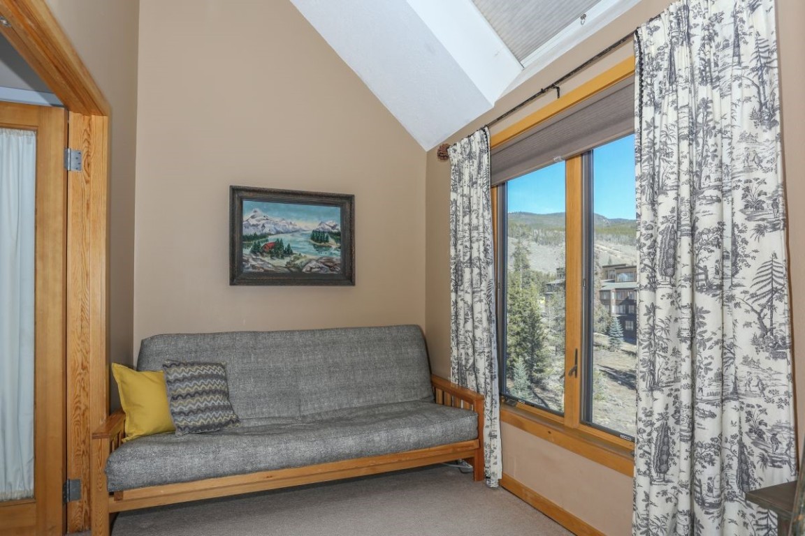 21680 Highway 6, Unit 2058 Keystone, CO 80435 - Photo 16 of 33 a living room with couch and a large window