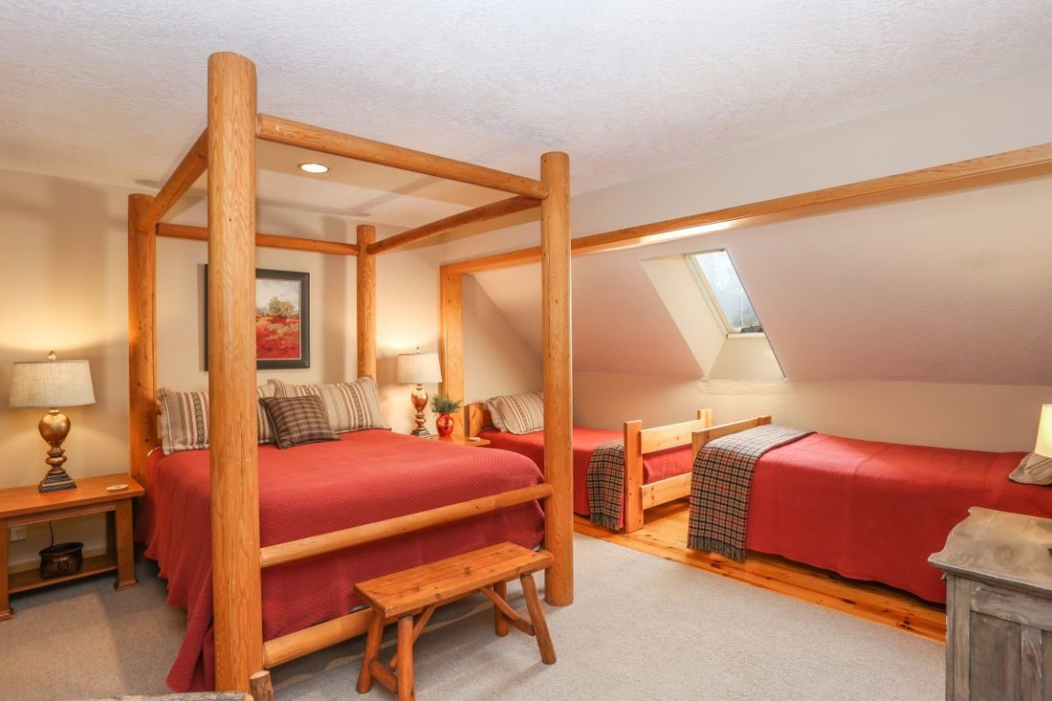 21680 Highway 6, Unit 2058 Keystone, CO 80435 - Photo 17 of 33 a bedroom with furniture and a window