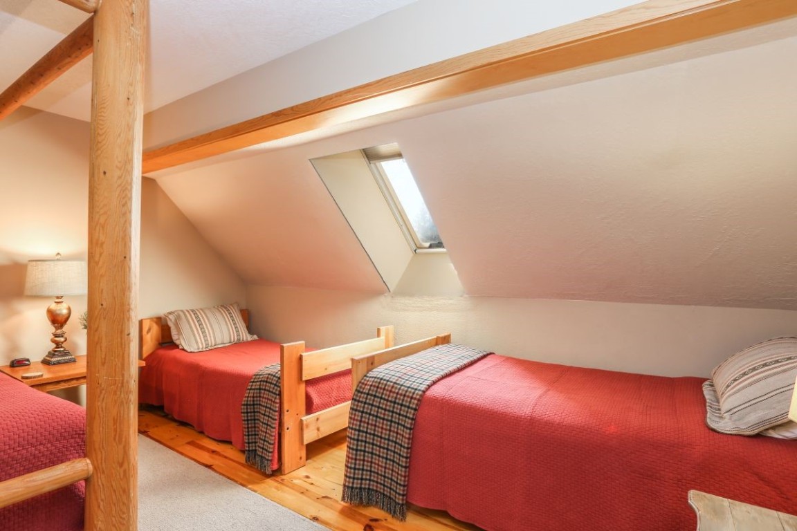 21680 Highway 6, Unit 2058 Keystone, CO 80435 - Photo 18 of 33 a bedroom with a bed and window