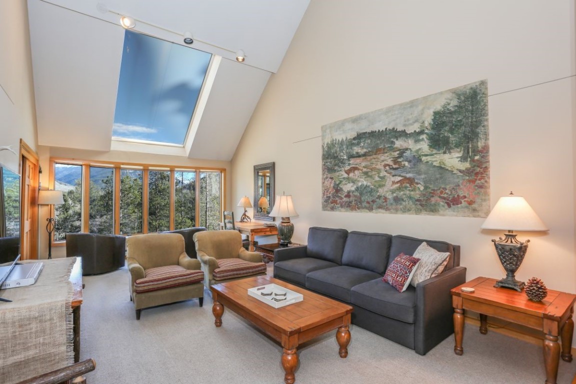 21680 Highway 6, Unit 2058 Keystone, CO 80435 - Photo 2 of 33 a living room with furniture and a large window