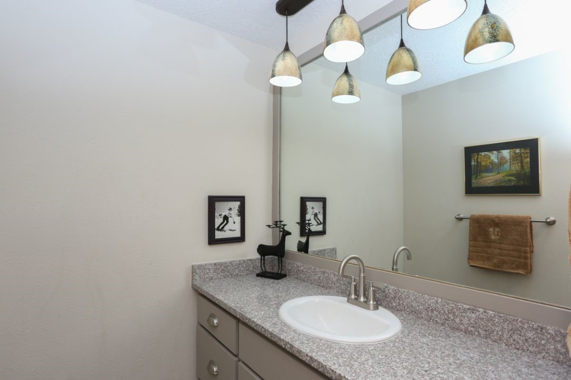 21680 Highway 6, Unit 2058 Keystone, CO 80435 - Photo 21 of 33 a bathroom with a sink and a mirror