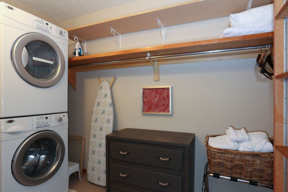 21680 Highway 6, Unit 2058 Keystone, CO 80435 - Photo 23 of 33 a utility room with dryer and washer
