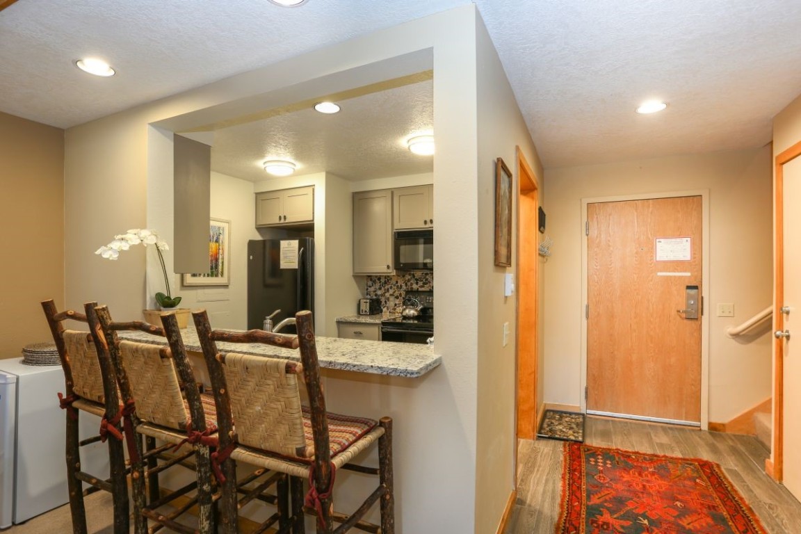 21680 Highway 6, Unit 2058 Keystone, CO 80435 - Photo 8 of 33 a view of a dining room with furniture