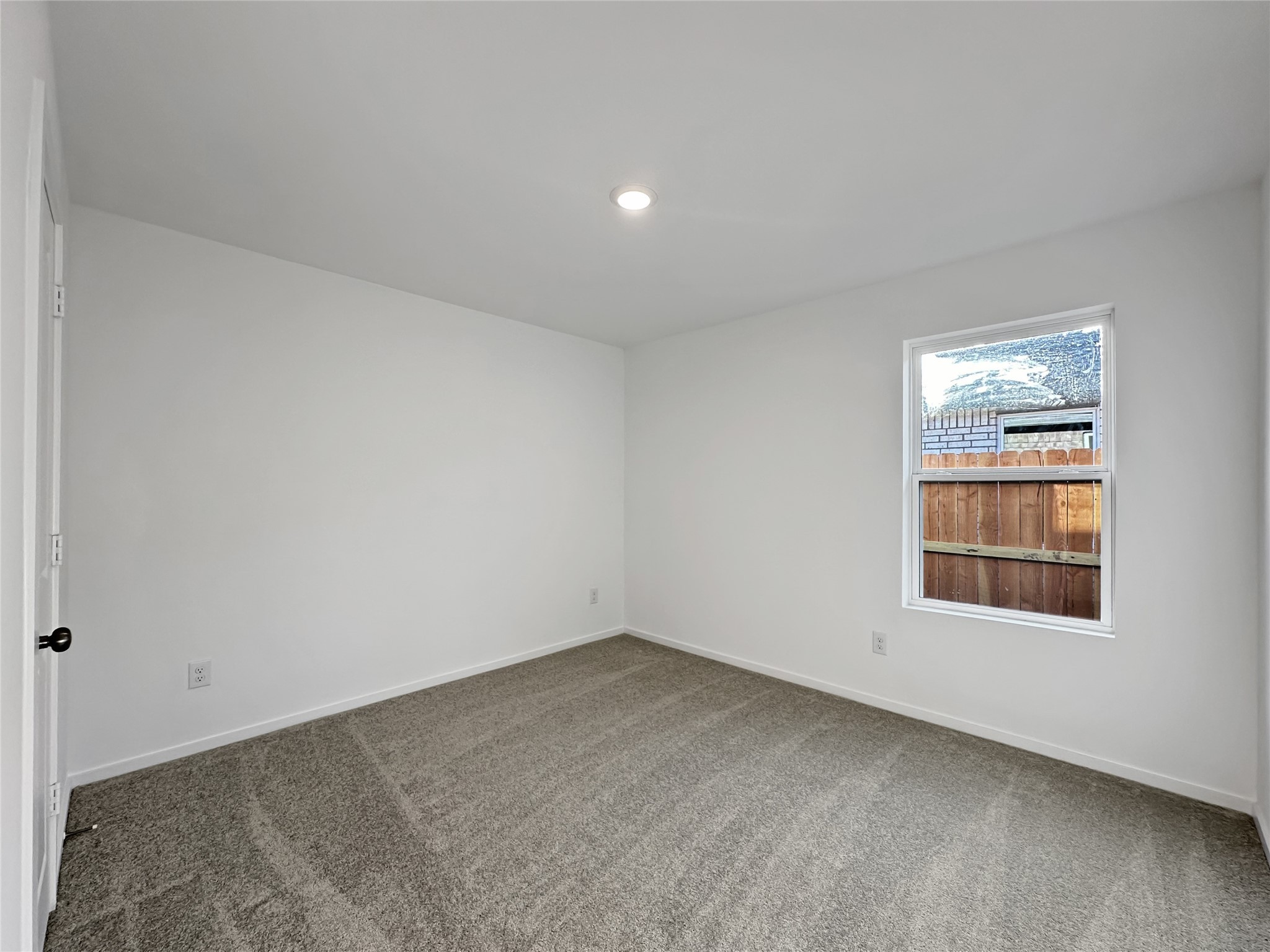 1715 Windrose Bend Angleton, TX 77515 - Photo 14 of 26 an empty room with a window