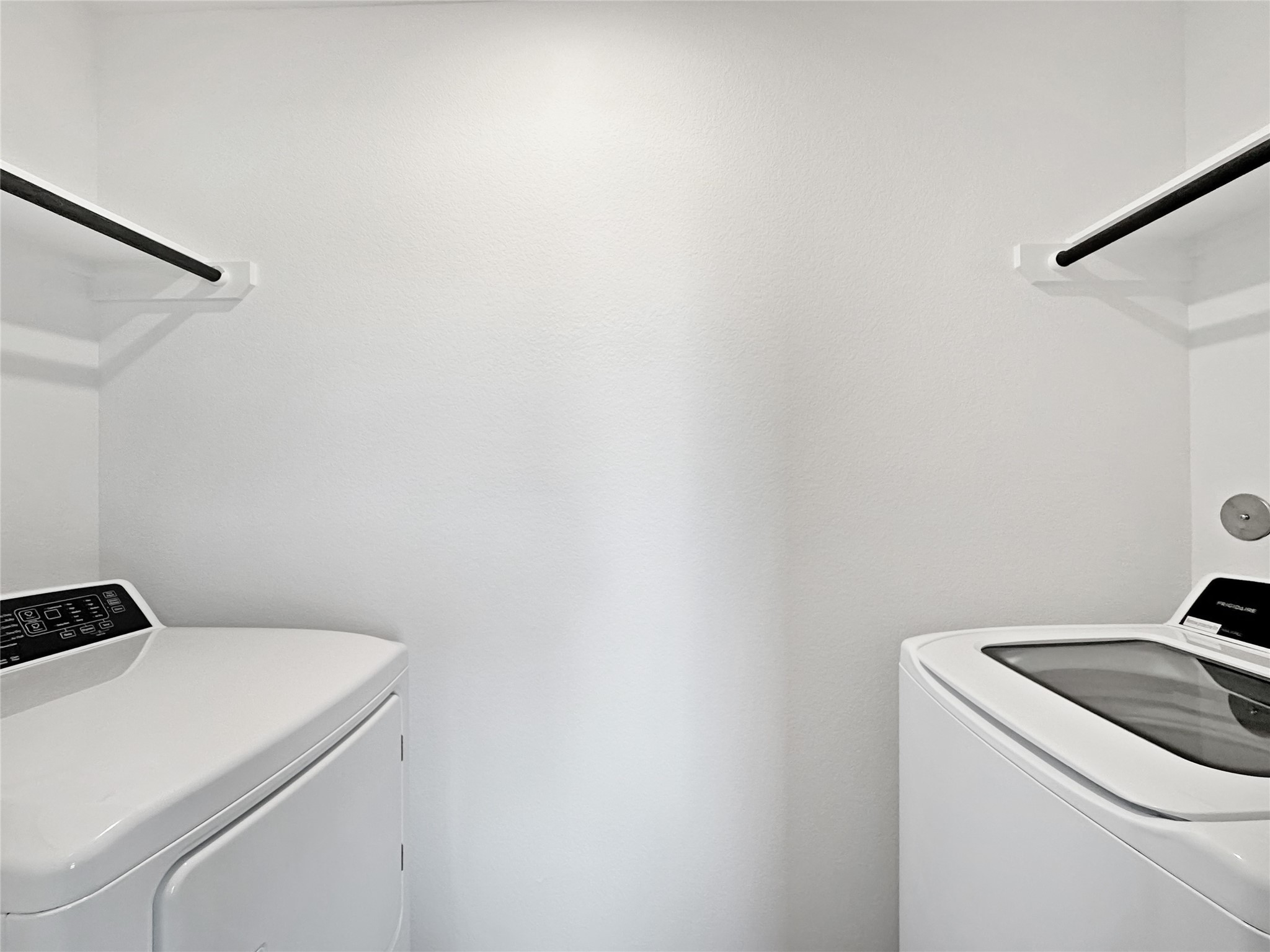 1715 Windrose Bend Angleton, TX 77515 - Photo 17 of 26 a utility room with dryer and washer