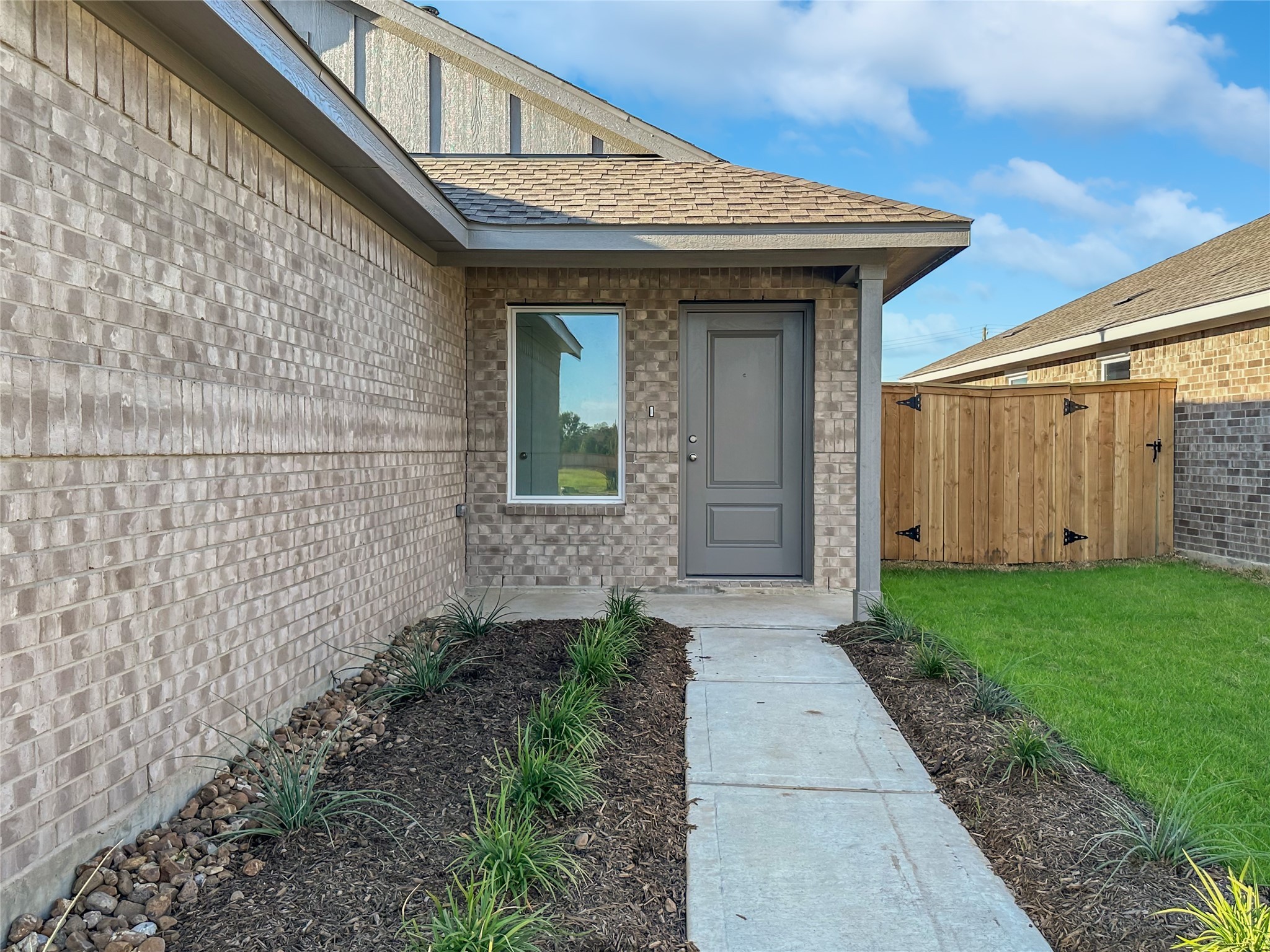 1715 Windrose Bend Angleton, TX 77515 - Photo 2 of 26 a view of a house with a small yard and wooden floor and fence