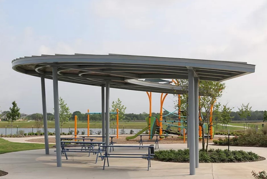 1715 Windrose Bend Angleton, TX 77515 - Photo 25 of 26 a view of a terrace with a table and chairs under an umbrella