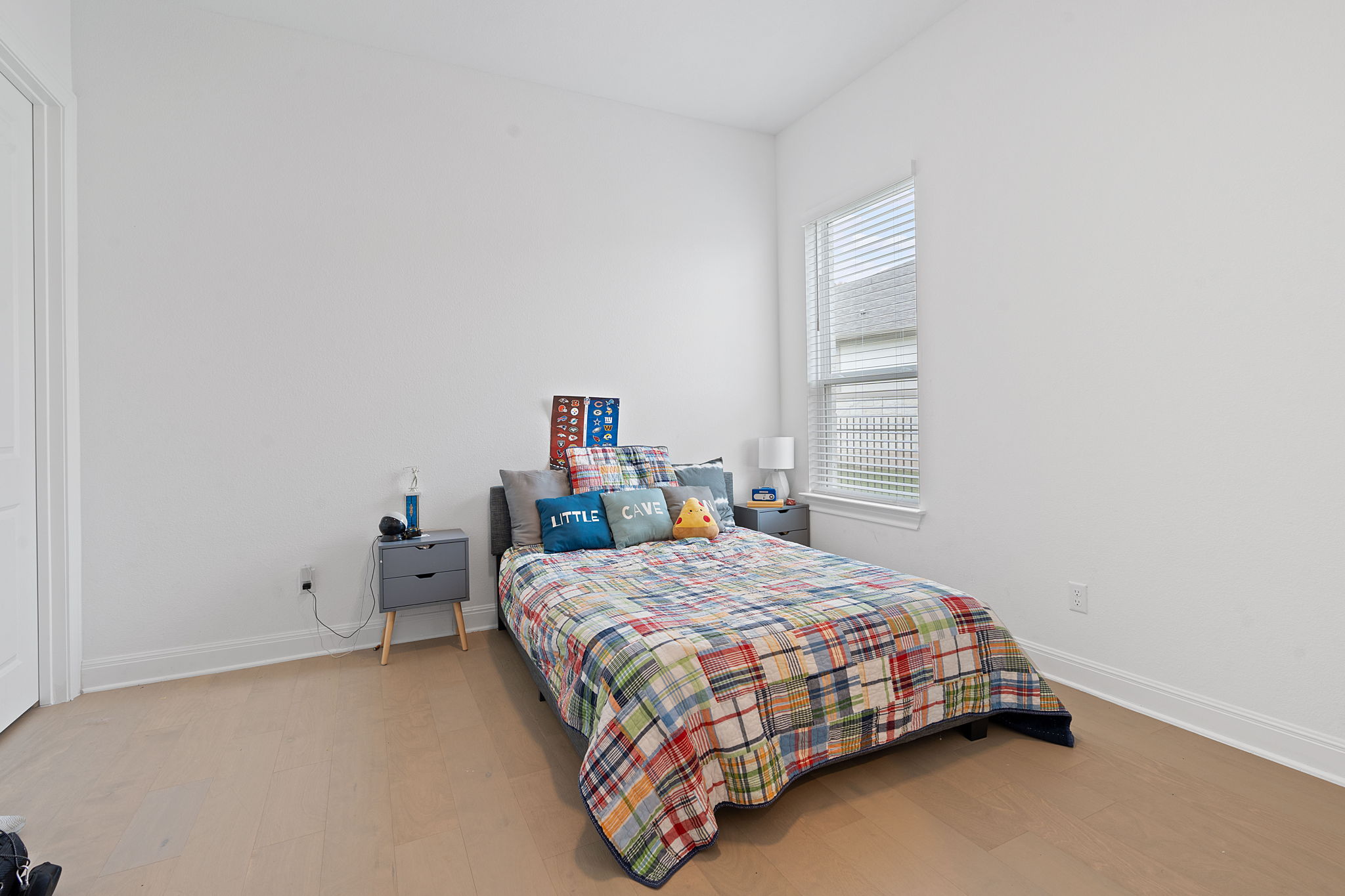 309 Pear Tree Lane Austin, TX 78737 - Photo 35 of 39 a bedroom with a bed and window