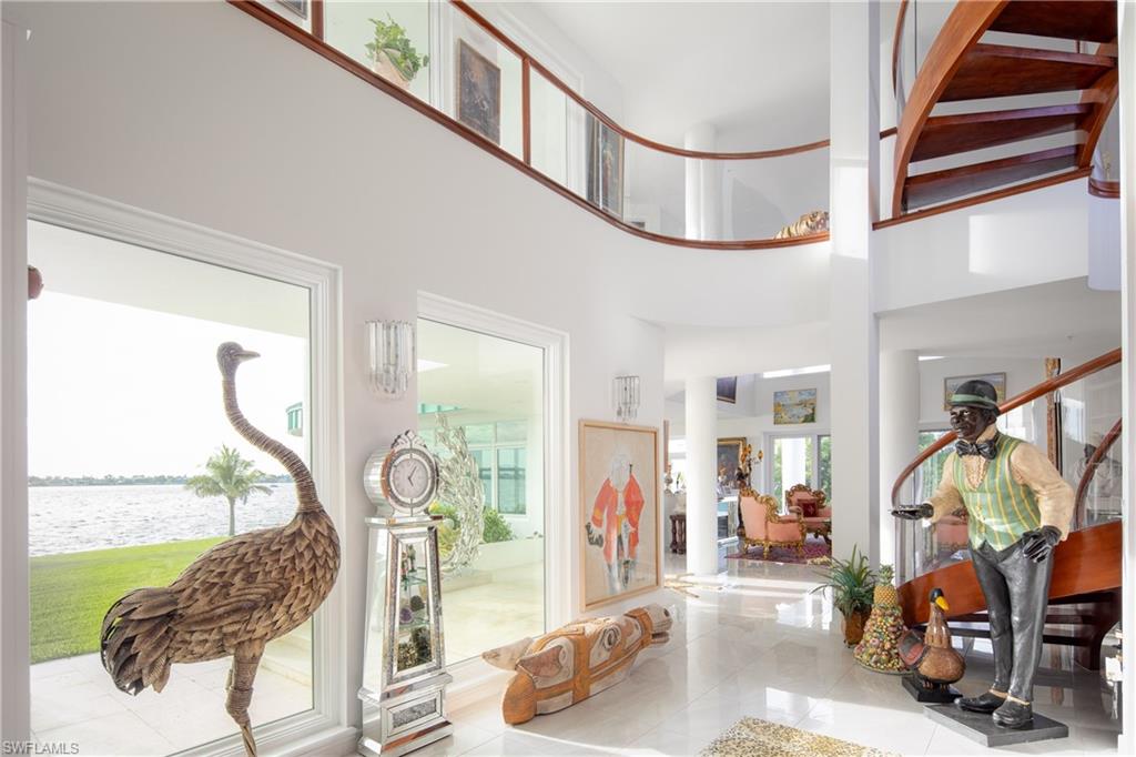 14040 Schultz Road Fort Myers, FL 33908 - Photo 27 of 48 Tiled entrance foyer with a high ceiling, a water view, and stairs