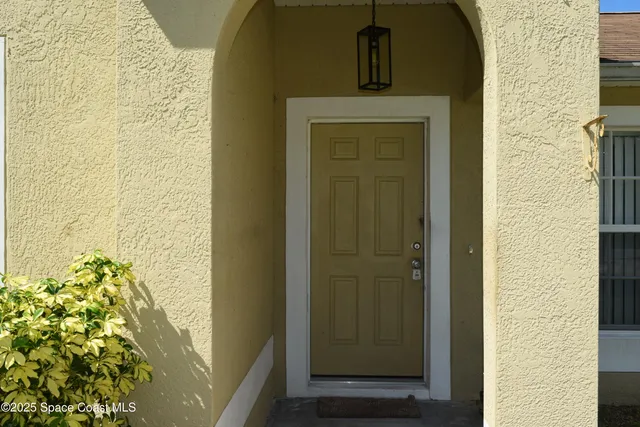 a kitchen with a sink and chandelier