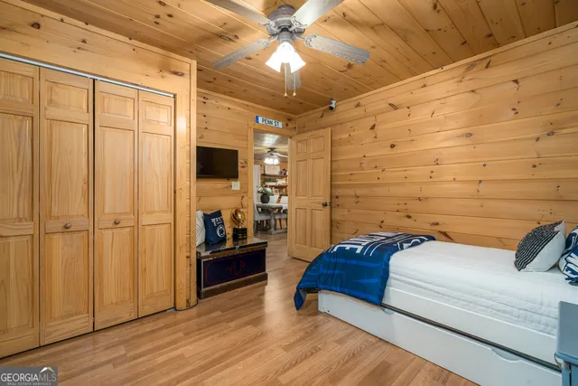 a view of walk in closet with clothes