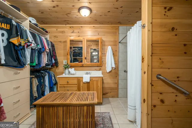 a kitchen with stainless steel appliances granite countertop a sink a stove and cabinets