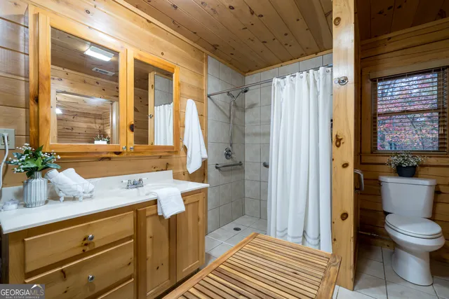 a kitchen with stainless steel appliances granite countertop lots of counter top space and wooden floor