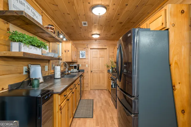 a living room with furniture a dining table and a fireplace
