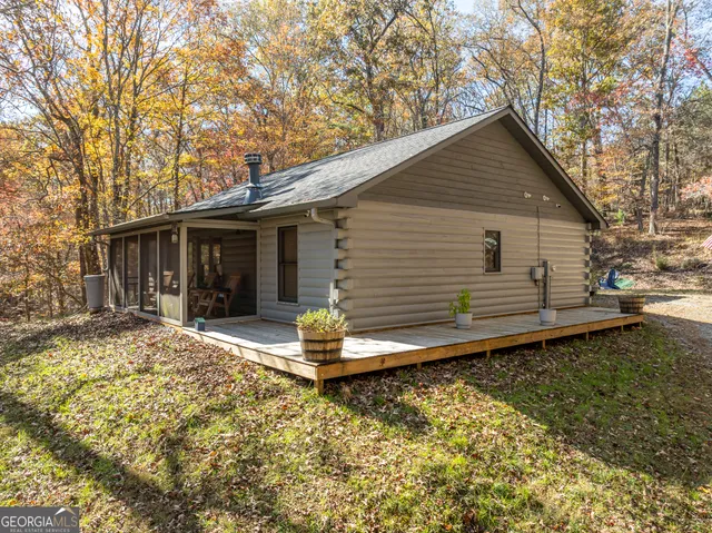 a view of a room with wooden floor and outdoor space