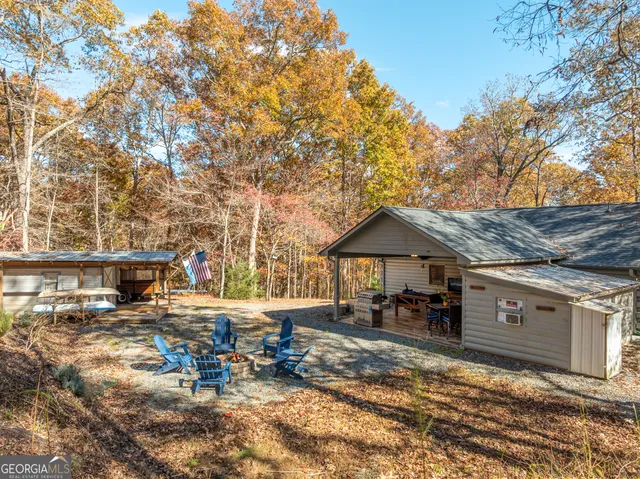 a bedroom with a bed and a ceiling fan