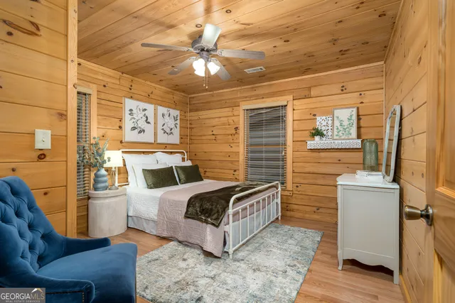 a bedroom with furniture and a fireplace