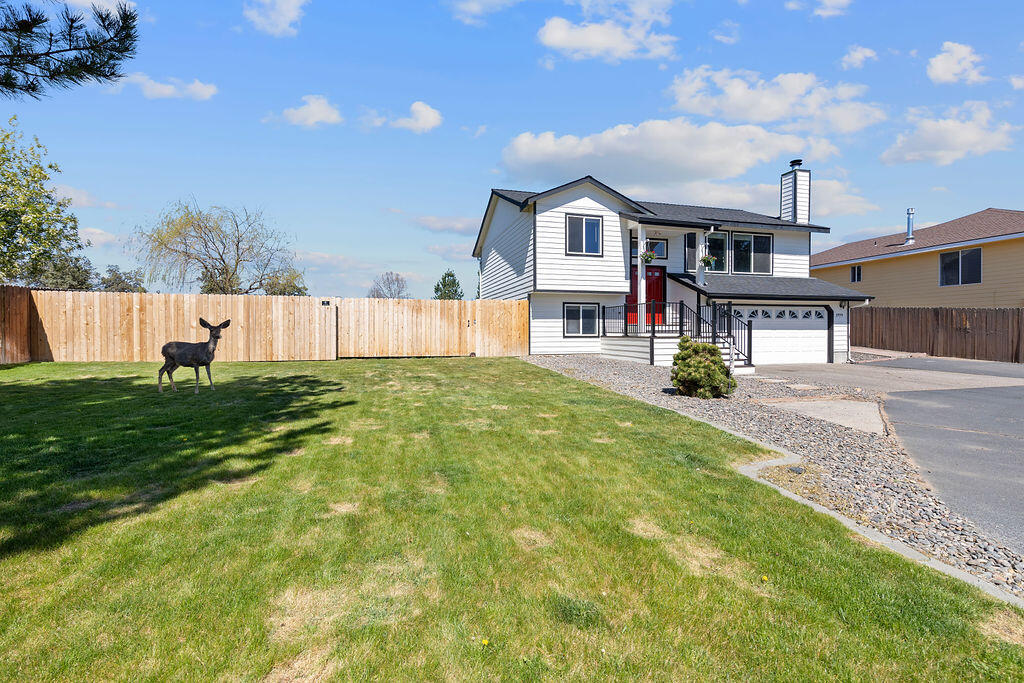 2979 Northeast Sugar Pine Road Prineville, OR 97754 - Photo 1 of 31 a front view of a house with a yard