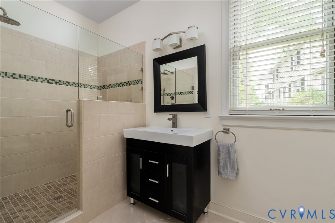 5414 New Kent Road Richmond, VA 23225 - Photo 25 of 62 a bathroom with a sink and a mirror