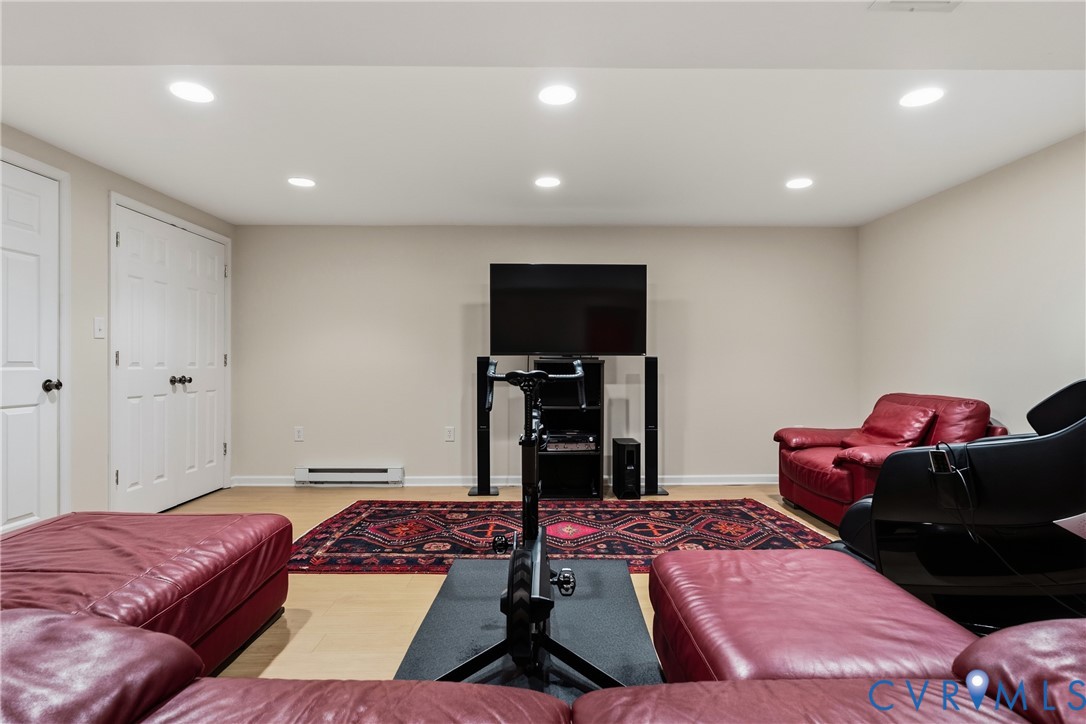5414 New Kent Road Richmond, VA 23225 - Photo 31 of 62 a living room with furniture and a flat screen tv