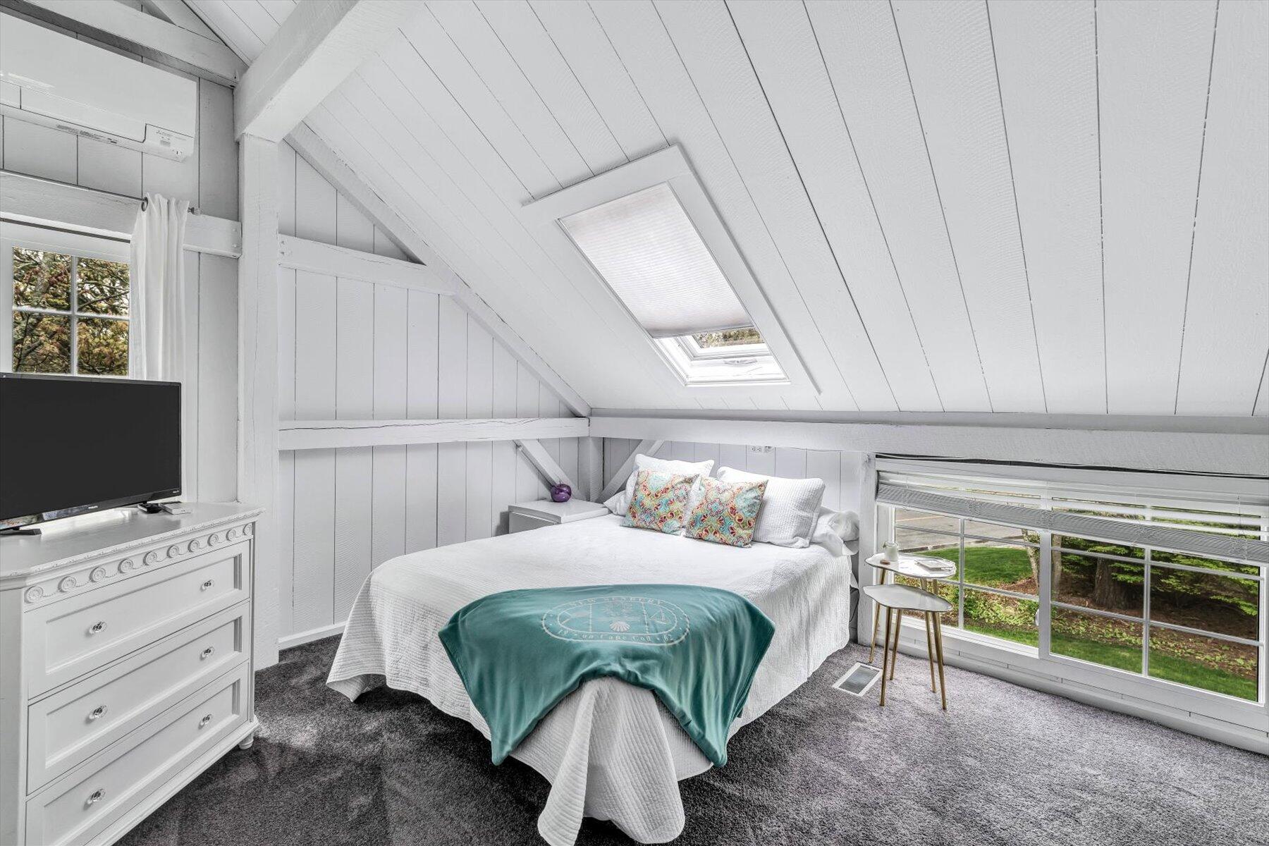 15 Greensward Road Mashpee, MA 02649 - Photo 18 of 27 a bedroom with a bed and a flat tv screen