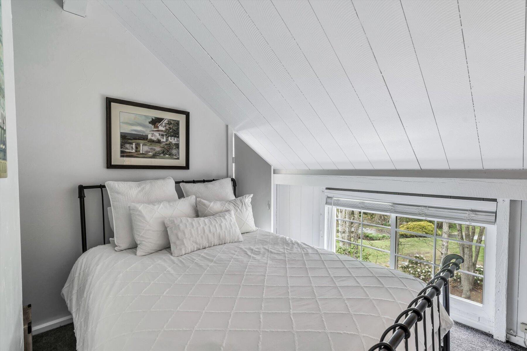 15 Greensward Road Mashpee, MA 02649 - Photo 20 of 27 a bedroom with a bed and a large window