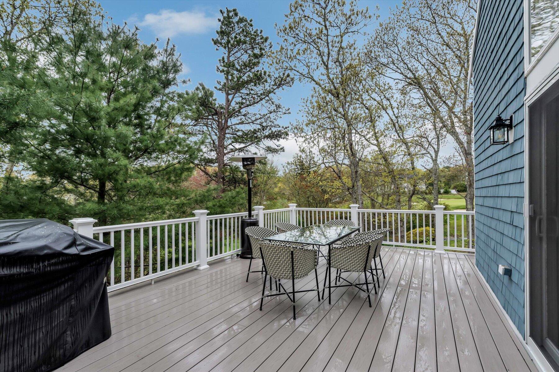 15 Greensward Road Mashpee, MA 02649 - Photo 23 of 27 a view of a deck with two chair and wooden floor