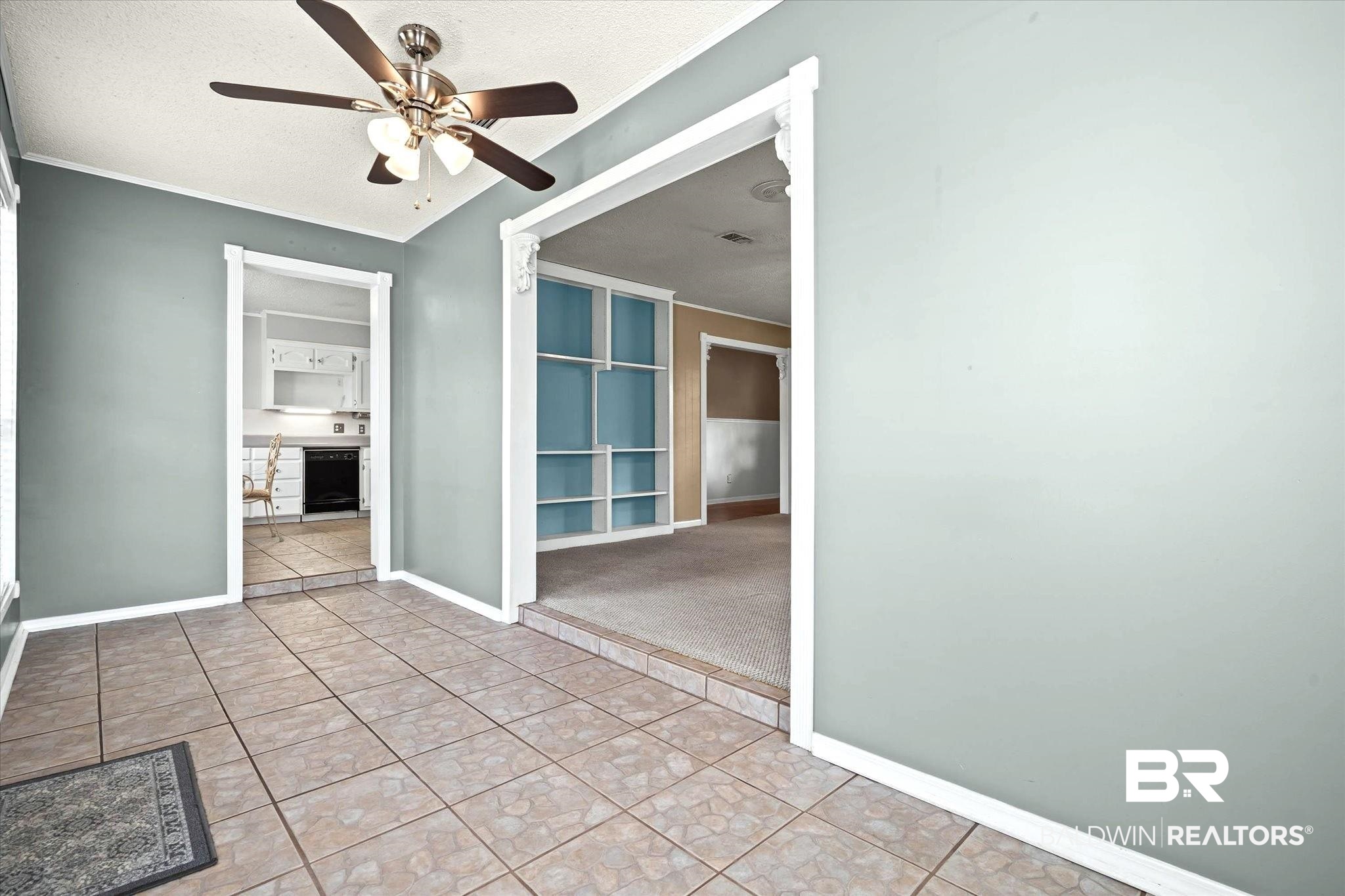 8090 Murray Hill Road Irvington, AL 36544 - Photo 13 of 40 Sunroom looking into living room and kitchen