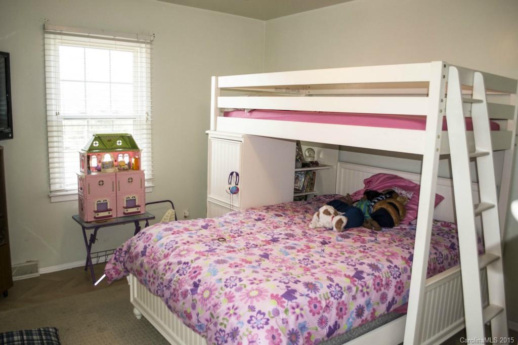 8710 Houston Ridge Road, Unit 21 Charlotte, NC 28277 - Photo 15 of 22 a bed room with a bed and a chair