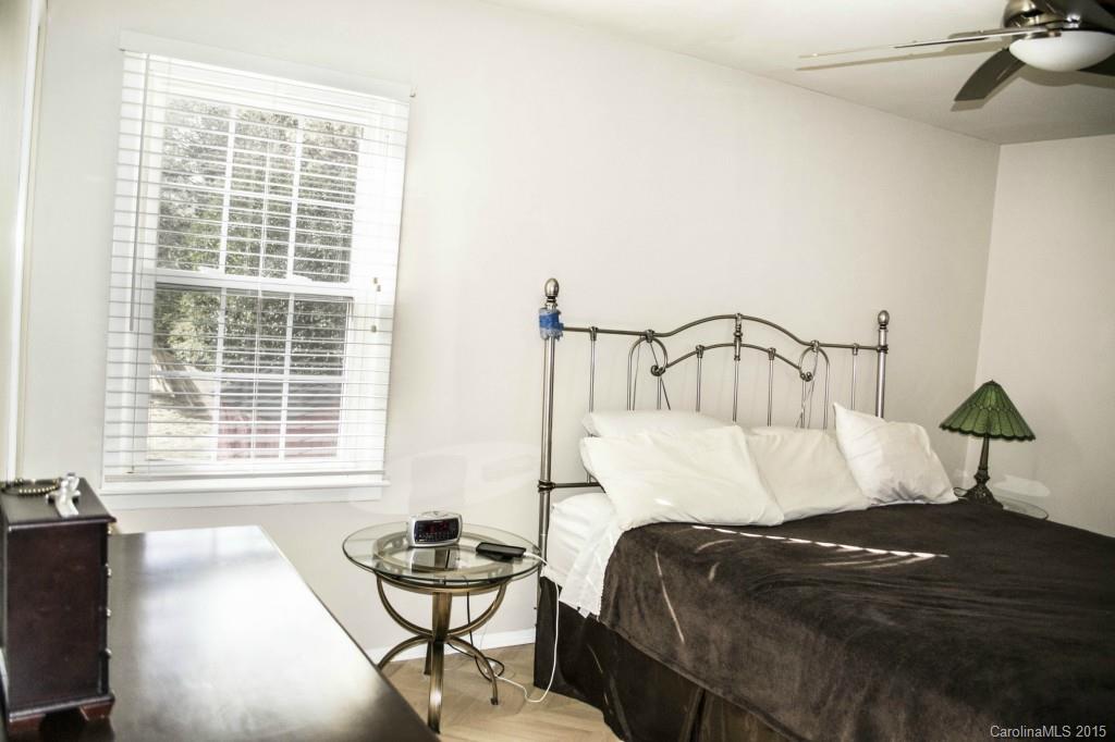 8710 Houston Ridge Road, Unit 21 Charlotte, NC 28277 - Photo 17 of 22 a bedroom with a bed and window
