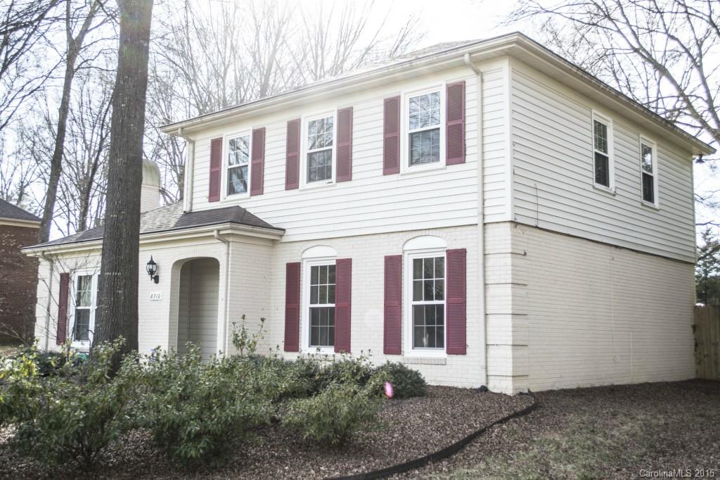 8710 Houston Ridge Road, Unit 21 Charlotte, NC 28277 - Photo 3 of 22 a view of a white house with large windows and a tree