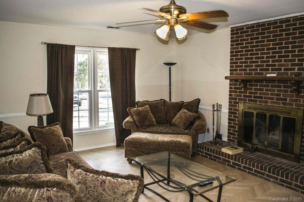 8710 Houston Ridge Road, Unit 21 Charlotte, NC 28277 - Photo 7 of 22 a living room with furniture a window and a fireplace